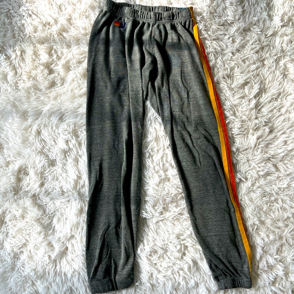 Grey aviator nation sweatpants with rainbow stripes down the side size xs